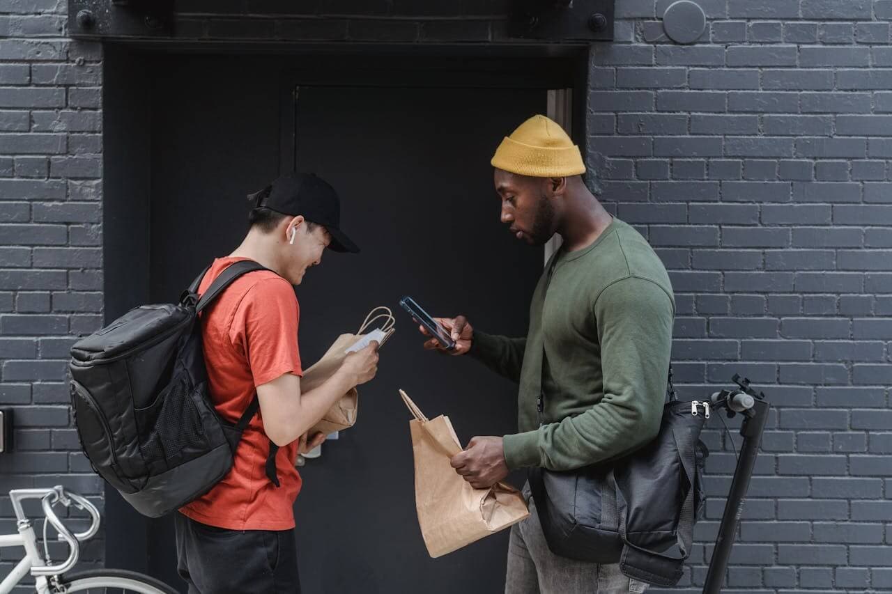 Couriers exchanging a delivery